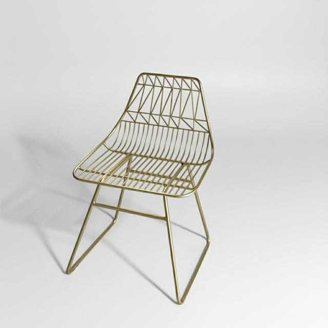 Silla de comedor decorada dorada